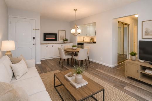View from the living room toward the entry and kitchen pass-through